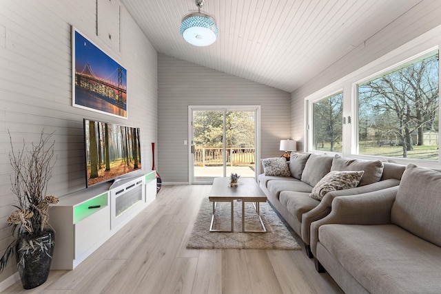 13804 Euclid Ct, Apple Valley, MN 55124 - living area featuring wood finished floors, wood walls, and high vaulted ceiling