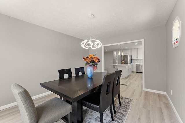 13804 Euclid Ct, Apple Valley, MN 55124 - dining room featuring light wood-style flooring, a chandelier, and recessed lighting