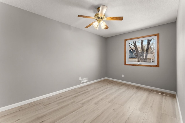 13804 Euclid Ct, Apple Valley, MN 55124 - unfurnished room featuring light wood-style floors, a ceiling fan, and a textured ceiling