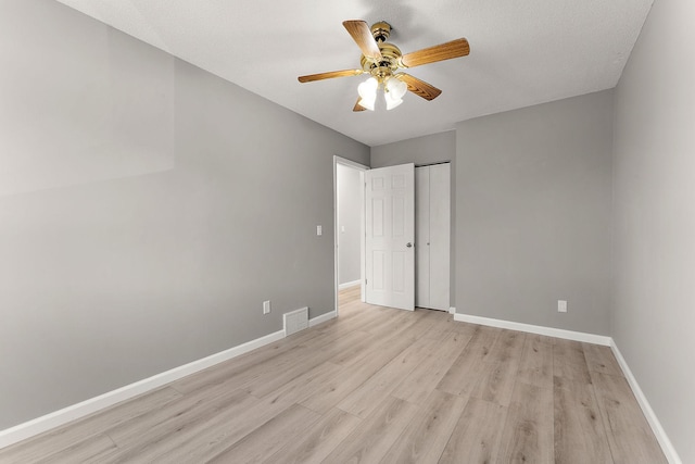 13804 Euclid Ct, Apple Valley, MN 55124 - unfurnished bedroom with light wood-style floors, a closet, and ceiling fan