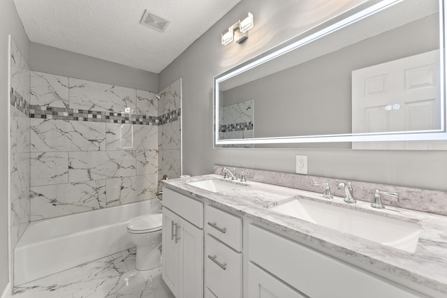 13804 Euclid Ct, Apple Valley, MN 55124 - bathroom featuring marble look tiles, double vanity, bathtub / shower combination, and a textured ceiling
