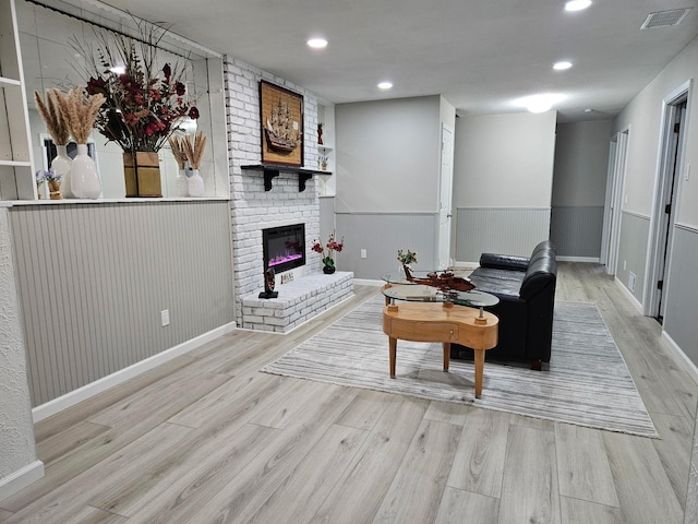 13804 Euclid Ct, Apple Valley, MN 55124 - living room featuring wood finished floors, a fireplace, recessed lighting, baseboards, and wainscoting