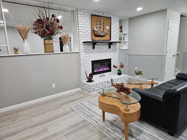 13804 Euclid Ct, Apple Valley, MN 55124 - living area with wood finished floors, a fireplace, wainscoting, and recessed lighting