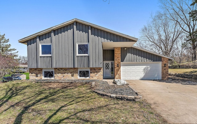 13804 Euclid Ct, Apple Valley, MN 55124 - view of front of home featuring board and batten siding, a garage, driveway, a front lawn, and brick siding