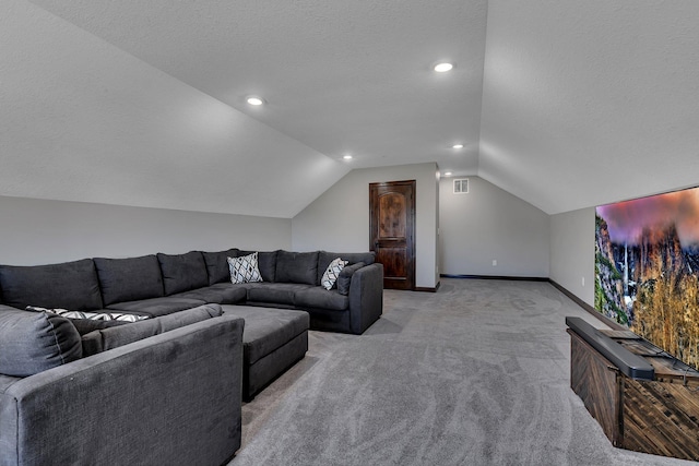 living area with light colored carpet, a textured ceiling, baseboards, and vaulted ceiling