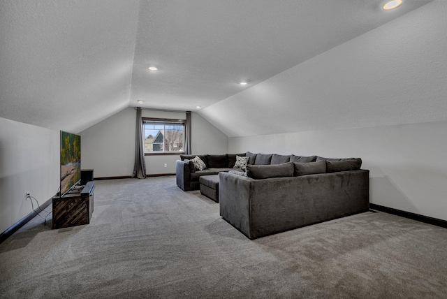 carpeted living room with a textured ceiling, baseboards, recessed lighting, and lofted ceiling