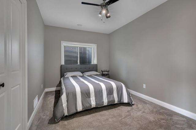 carpeted bedroom with a ceiling fan, baseboards, and visible vents