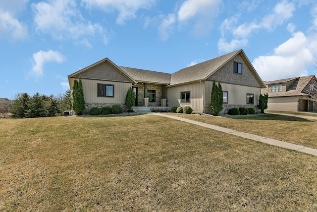 3346 Old Stone Way NE, Sauk Rapids, MN 56379 - view of front of property with stone siding, a front lawn, and board and batten siding