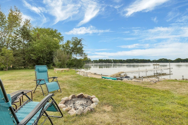 view of yard with a dock and a water view