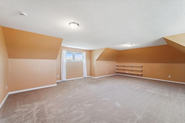 2724 Neal Ave N, West Lakeland Twp, MN 55082 - bonus room with vaulted ceiling, a textured ceiling, carpet flooring, and baseboards