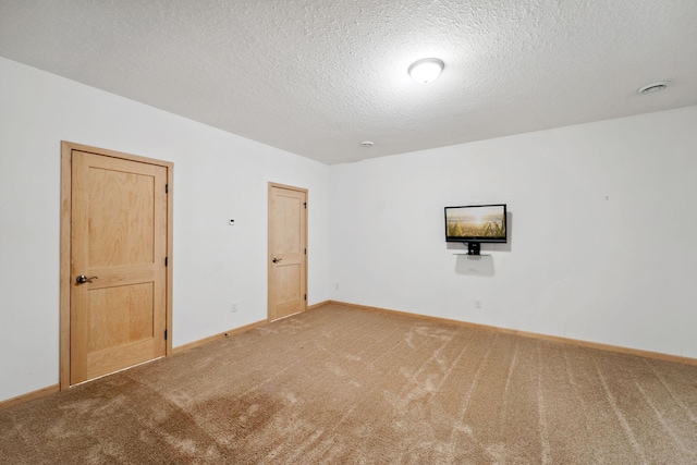 2724 Neal Ave N, West Lakeland Twp, MN 55082 - unfurnished room with carpet, baseboards, and a textured ceiling