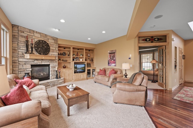 2469 Tournament Players Cir S, Blaine, MN 55449 - living area with recessed lighting, baseboards, a stone fireplace, and wood finished floors