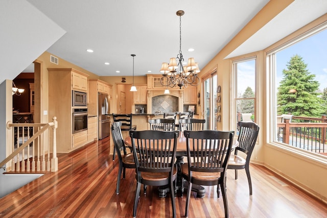 2469 Tournament Players Cir S, Blaine, MN 55449 - dining area featuring an inviting chandelier, a wealth of natural light, and visible vents