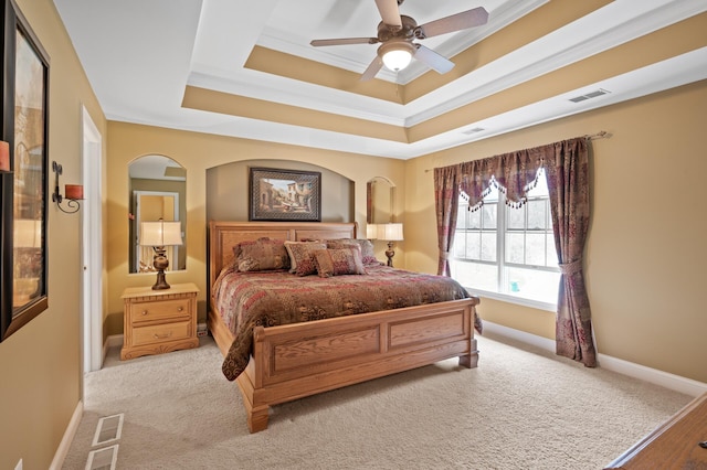 2469 Tournament Players Cir S, Blaine, MN 55449 - bedroom featuring light colored carpet, visible vents, baseboards, ornamental molding, and a tray ceiling