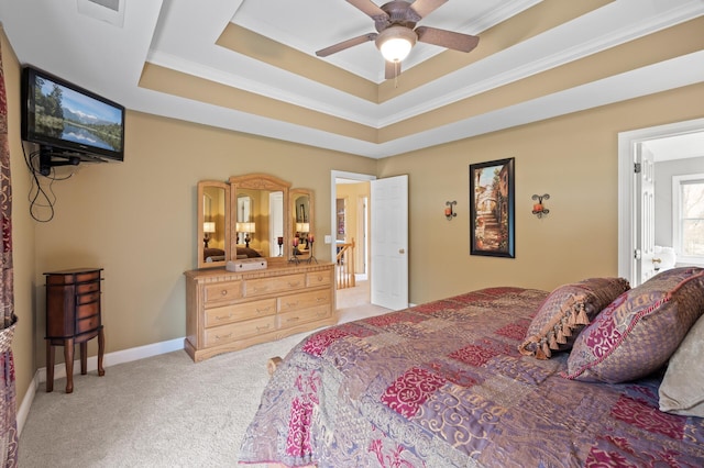 2469 Tournament Players Cir S, Blaine, MN 55449 - carpeted bedroom with crown molding, a ceiling fan, and a tray ceiling