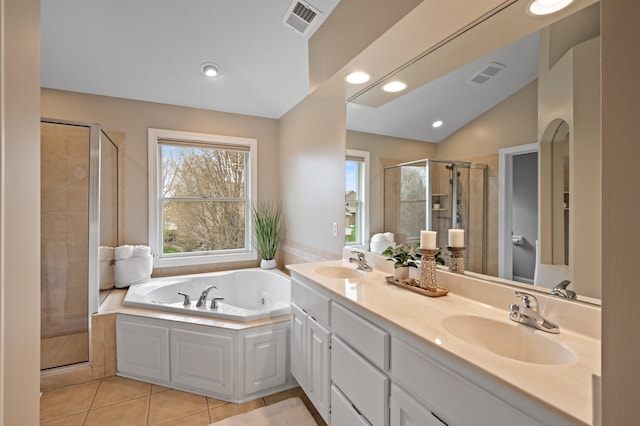 2469 Tournament Players Cir S, Blaine, MN 55449 - bathroom with a sink, a shower stall, a bath, and visible vents
