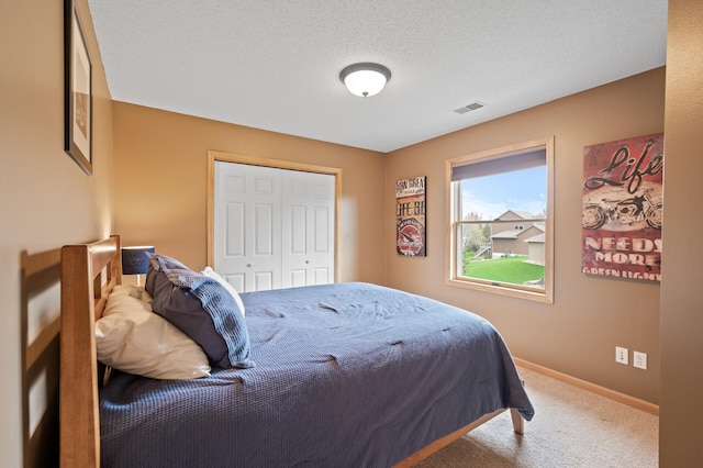 2469 Tournament Players Cir S, Blaine, MN 55449 - bedroom with a closet, baseboards, carpet flooring, and visible vents
