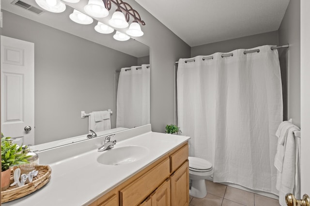 2469 Tournament Players Cir S, Blaine, MN 55449 - bathroom with visible vents, tile patterned flooring, vanity, toilet, and a shower with shower curtain