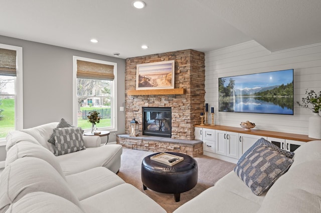 2469 Tournament Players Cir S, Blaine, MN 55449 - living area with recessed lighting, wood walls, light carpet, and a fireplace