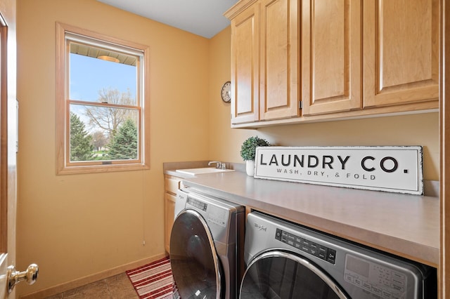 2469 Tournament Players Cir S, Blaine, MN 55449 - clothes washing area featuring a sink, baseboards, independent washer and dryer, and cabinet space