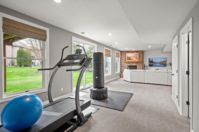 2469 Tournament Players Cir S, Blaine, MN 55449 - workout area with baseboards, carpet, recessed lighting, and a stone fireplace