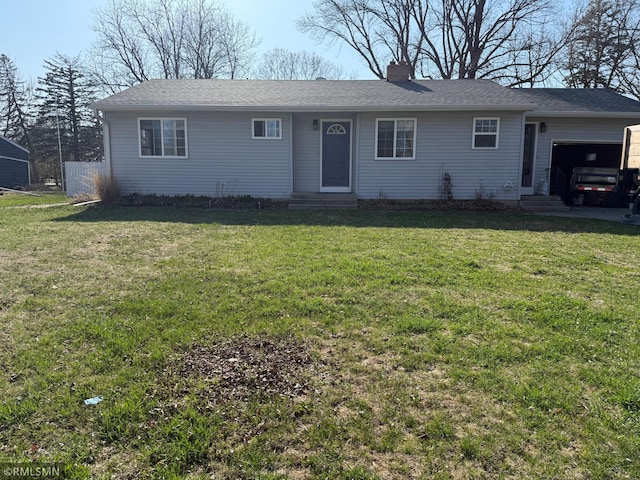ranch-style house with an attached garage, a front lawn, and entry steps