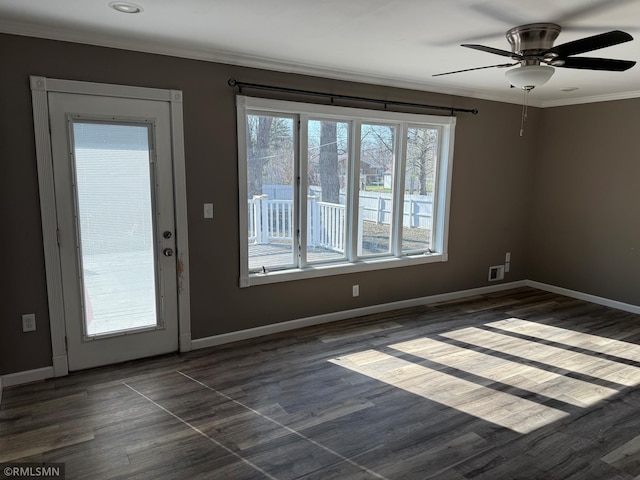 interior space featuring baseboards, dark wood-style flooring, ceiling fan, and crown molding