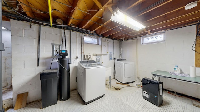 washroom featuring washer and clothes dryer and plenty of natural light