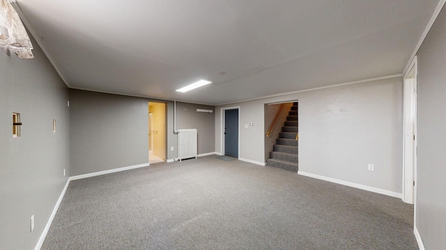 finished below grade area featuring carpet flooring, stairway, and baseboards
