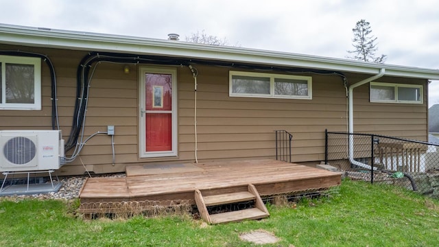 rear view of property featuring ac unit, fence, and a wooden deck