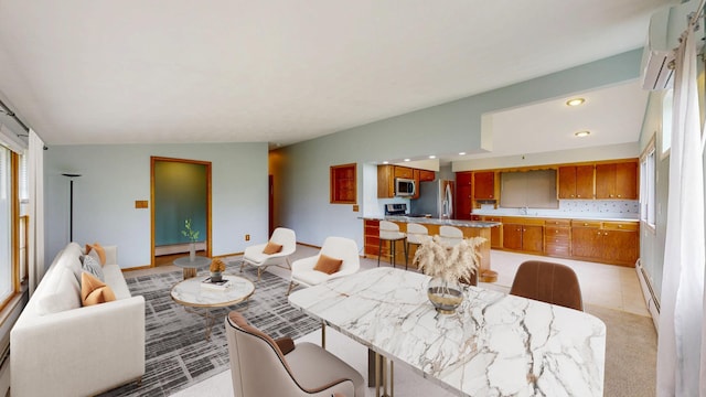 dining room featuring baseboard heating, recessed lighting, light carpet, and a wall mounted air conditioner
