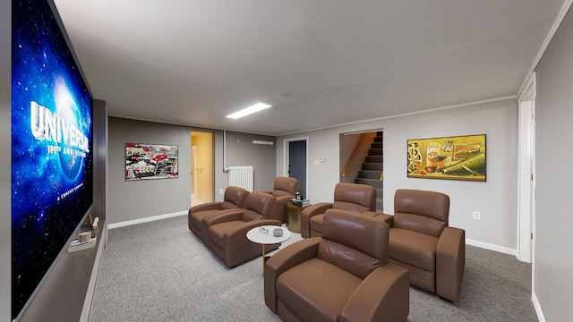 carpeted cinema room featuring baseboards