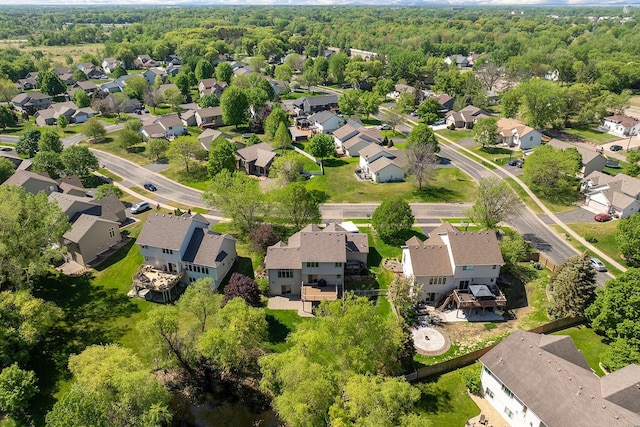aerial view of property's location with nearby suburban area