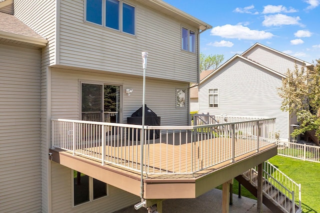2085 128th Ln NE, Blaine, MN 55449 - rear view of property featuring a wooden deck, a lawn, and stairway