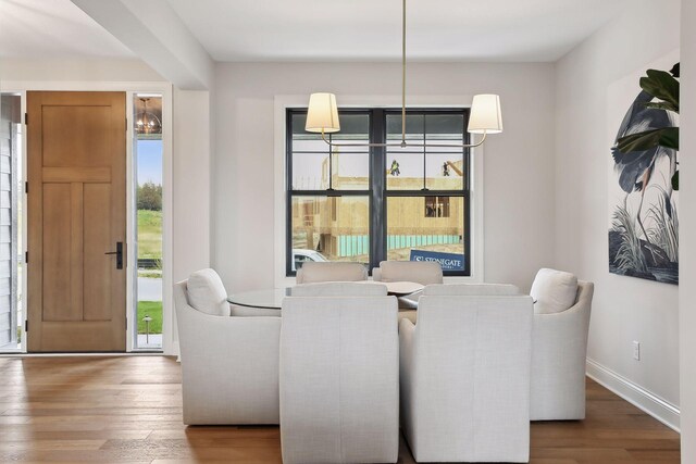 9511 Eagle Ridge Rd, Chanhassen, MN 55317 - dining space featuring wood finished floors and baseboards