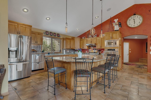 26182 Jericho Rd, Saint Joseph Twp, MN 56301 - kitchen featuring appliances with stainless steel finishes, high vaulted ceiling, a sink, light stone countertops, and a kitchen breakfast bar