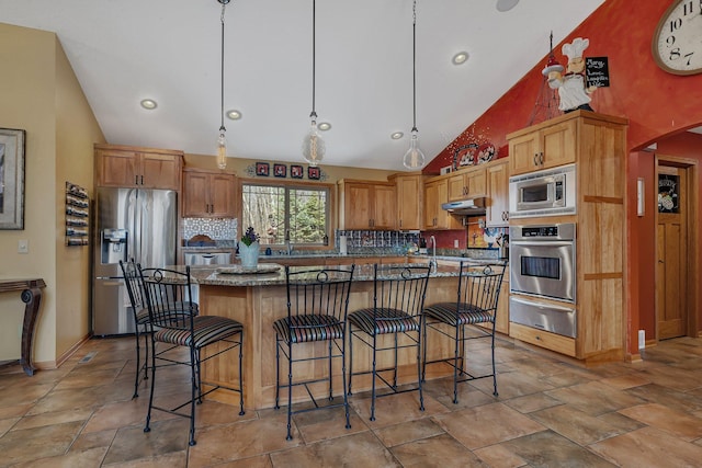 26182 Jericho Rd, Saint Joseph Twp, MN 56301 - kitchen featuring appliances with stainless steel finishes, a warming drawer, high vaulted ceiling, decorative backsplash, and a kitchen bar