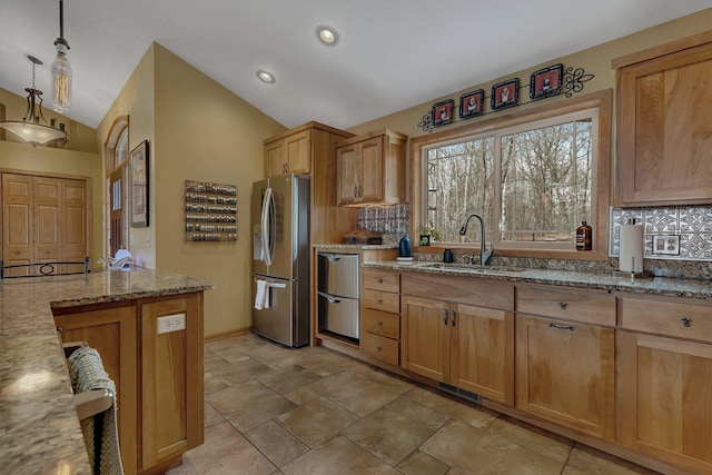 26182 Jericho Rd, Saint Joseph Twp, MN 56301 - kitchen featuring appliances with stainless steel finishes, a sink, tasteful backsplash, lofted ceiling, and light stone counters