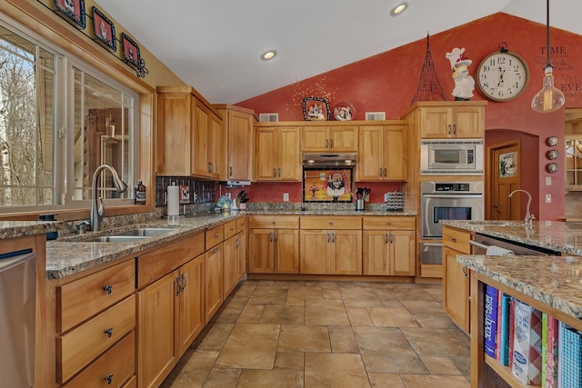 26182 Jericho Rd, Saint Joseph Twp, MN 56301 - kitchen with appliances with stainless steel finishes, a sink, a warming drawer, light stone finish flooring, and high vaulted ceiling