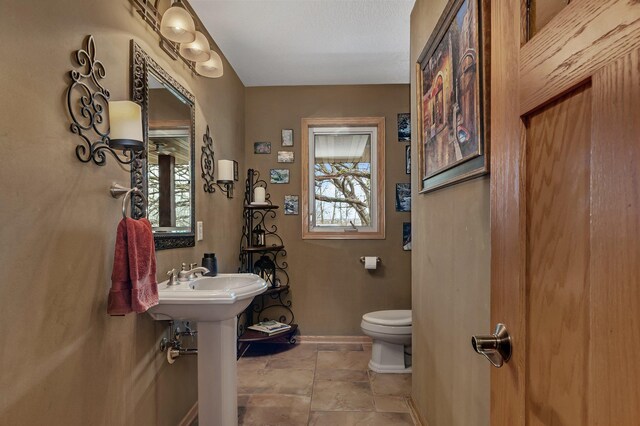 26182 Jericho Rd, Saint Joseph Twp, MN 56301 - bathroom with toilet and baseboards