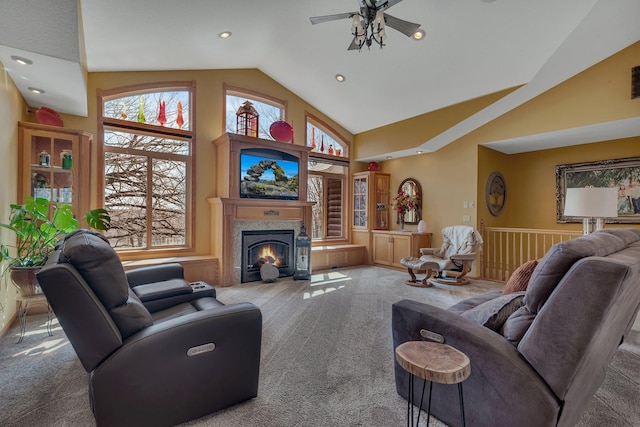 26182 Jericho Rd, Saint Joseph Twp, MN 56301 - carpeted living area featuring high vaulted ceiling, ceiling fan, recessed lighting, a lit fireplace, and a wainscoted wall