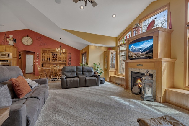 26182 Jericho Rd, Saint Joseph Twp, MN 56301 - living area featuring carpet, a chandelier, high vaulted ceiling, and a fireplace with flush hearth