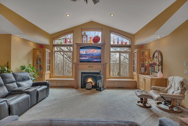 26182 Jericho Rd, Saint Joseph Twp, MN 56301 - carpeted living area with lofted ceiling, a fireplace with flush hearth, and recessed lighting