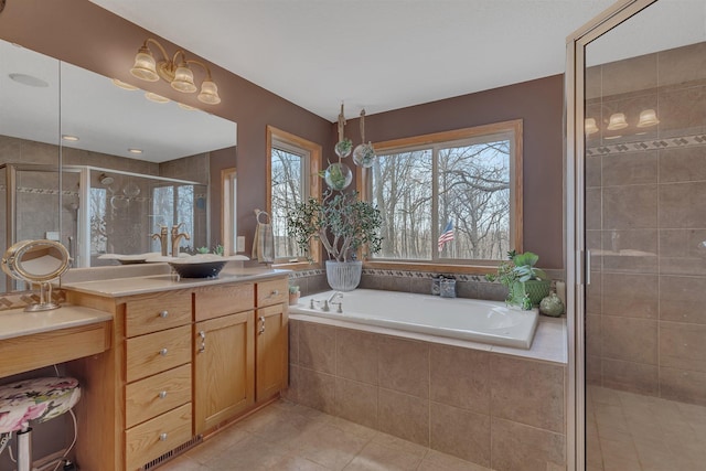 26182 Jericho Rd, Saint Joseph Twp, MN 56301 - full bath with tile patterned floors, vanity, a garden tub, and a stall shower