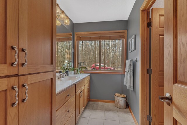 26182 Jericho Rd, Saint Joseph Twp, MN 56301 - bathroom with vanity, tile patterned floors, and baseboards
