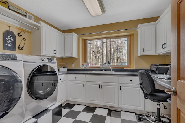 26182 Jericho Rd, Saint Joseph Twp, MN 56301 - laundry room with washing machine and clothes dryer, cabinet space, tile patterned floors, and a desk