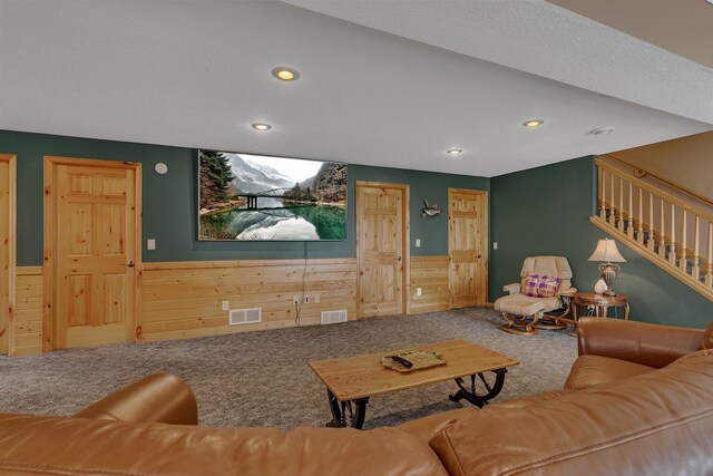 26182 Jericho Rd, Saint Joseph Twp, MN 56301 - living area with carpet flooring, wooden walls, wainscoting, recessed lighting, and stairway