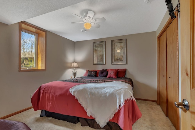 26182 Jericho Rd, Saint Joseph Twp, MN 56301 - bedroom featuring light colored carpet, baseboards, a textured ceiling, a closet, and ceiling fan