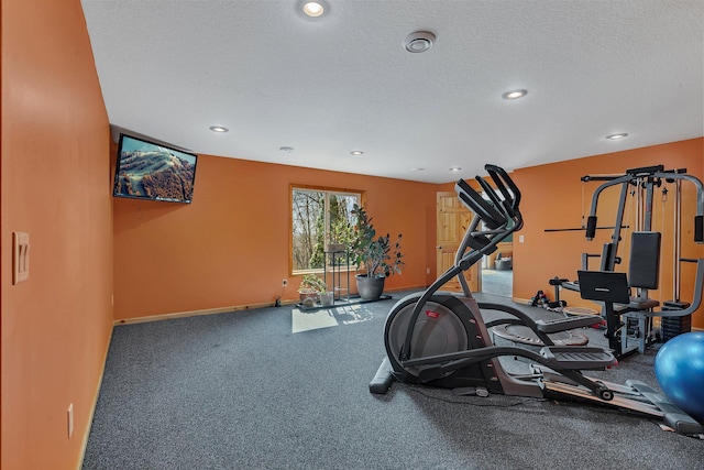 26182 Jericho Rd, Saint Joseph Twp, MN 56301 - exercise room with baseboards, a textured ceiling, and recessed lighting