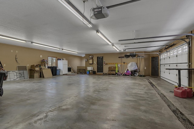 26182 Jericho Rd, Saint Joseph Twp, MN 56301 - garage with freestanding refrigerator and a garage door opener